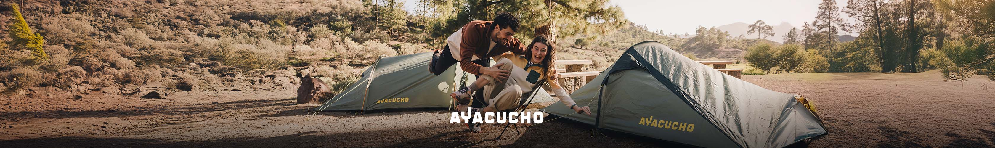 A group of people around a campervan wearing Ayacucho clothing